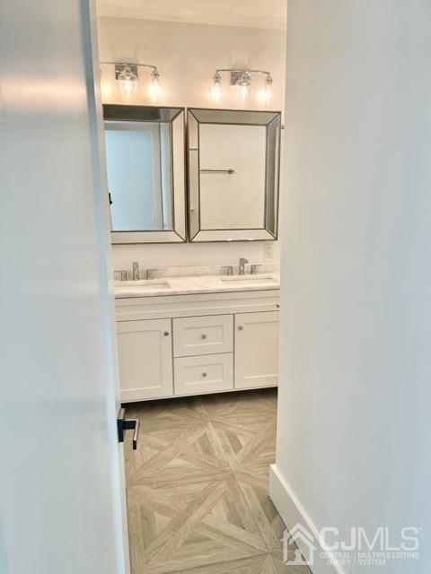 13 Emerald Road Kendall Park, NJ 08824 - Photo 15 of 24 a bathroom with a granite countertop sink a mirror and a