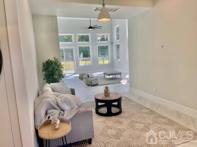 13 Emerald Road Kendall Park, NJ 08824 - Photo 4 of 24 a living room with furniture and a window