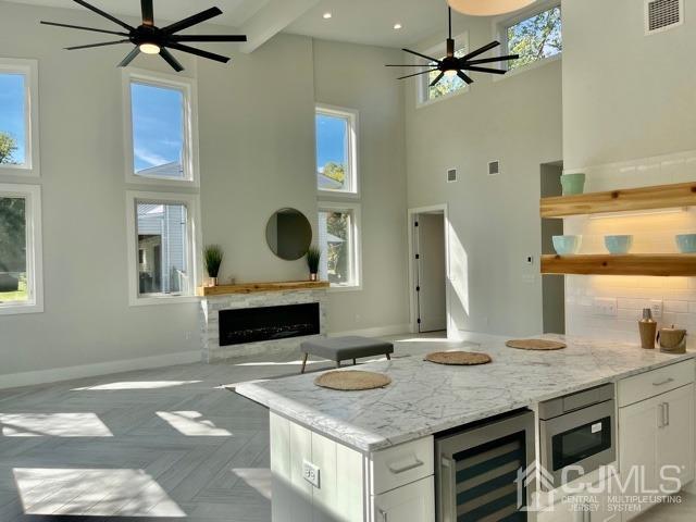 13 Emerald Road Kendall Park, NJ 08824 - Photo 10 of 24 a kitchen with a granite countertop sink and a stove
