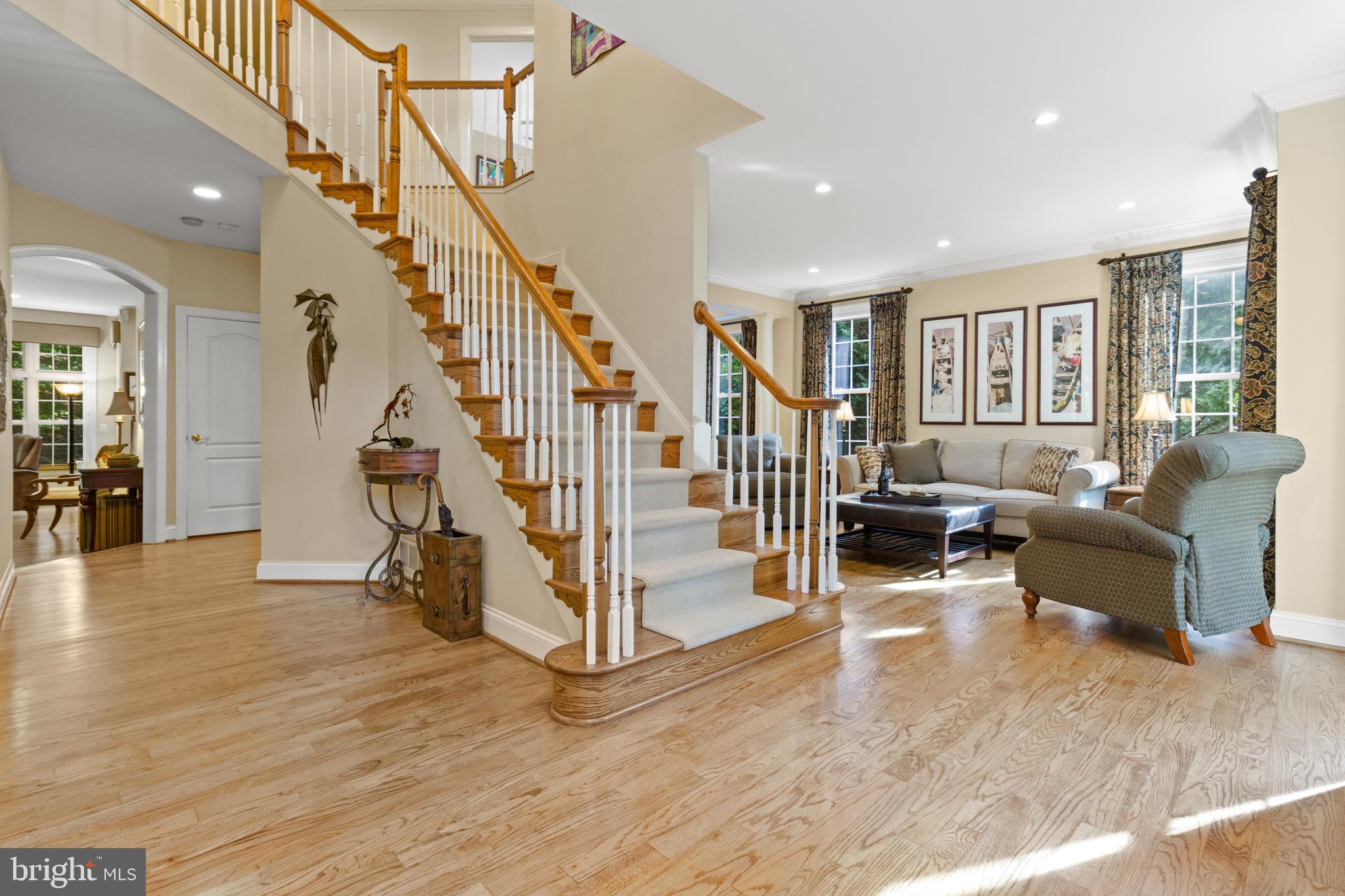 264 Woodard Road Arnold, MD 21012 - Photo 3 of 62 Graceful custom white and wood staircase.