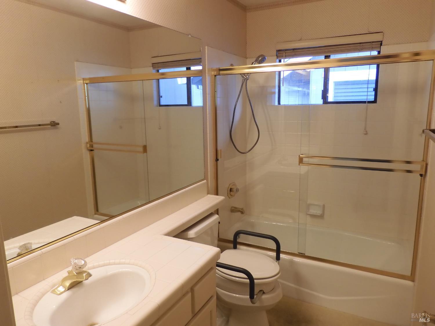 356 Singing Brook Circle Santa Rosa, CA 95409 - Photo 17 of 36 a bathroom with a sink and a mirror