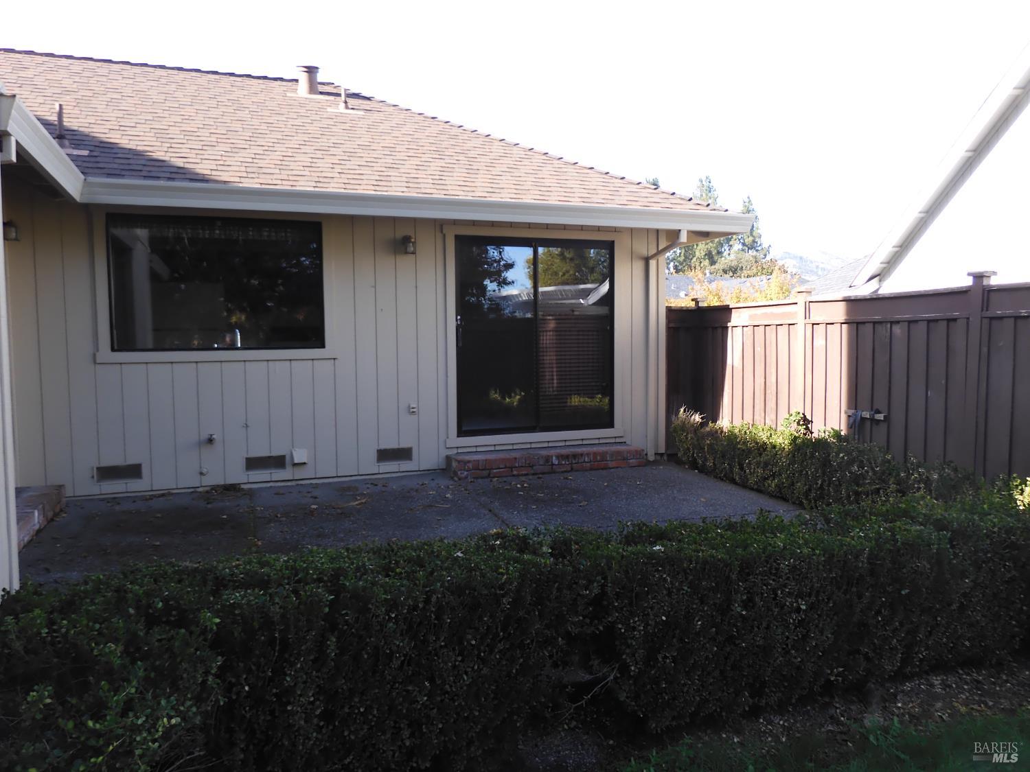 356 Singing Brook Circle Santa Rosa, CA 95409 - Photo 25 of 36 a view of house with backyard and glass windows