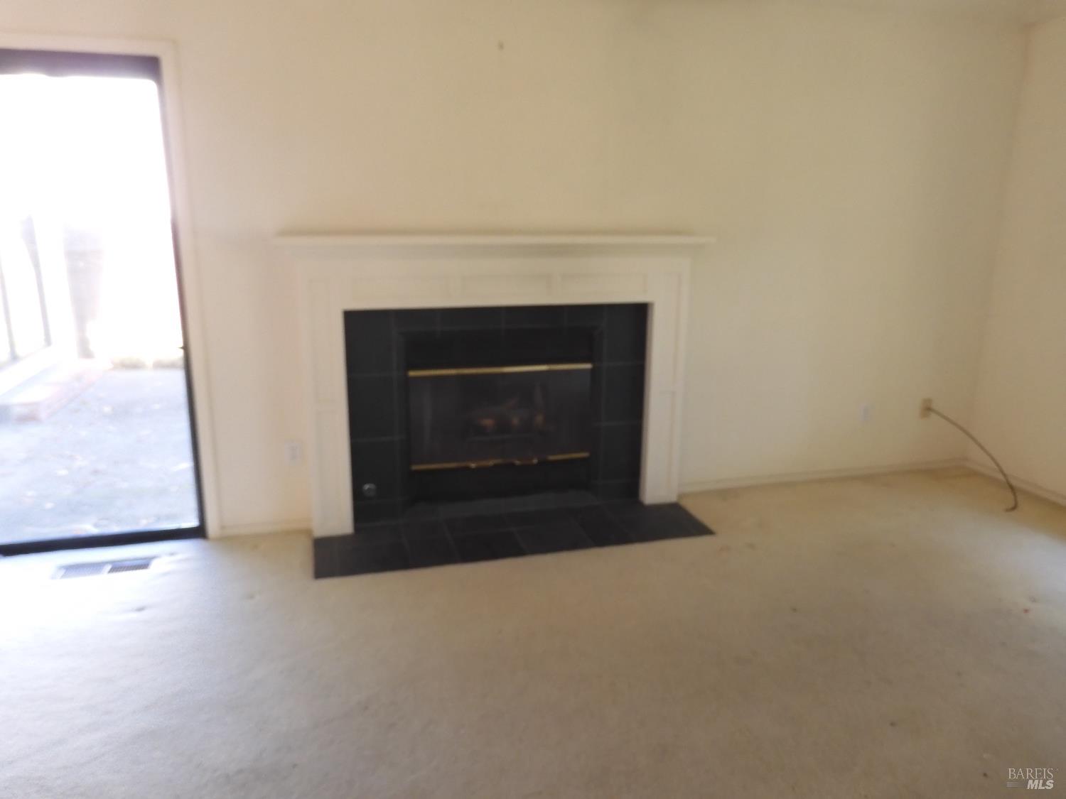 356 Singing Brook Circle Santa Rosa, CA 95409 - Photo 5 of 36 a living room with a fireplace