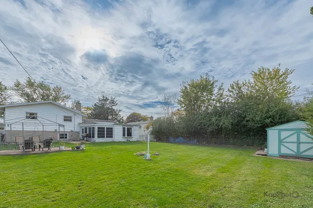 a view of a chairs and table in the garden