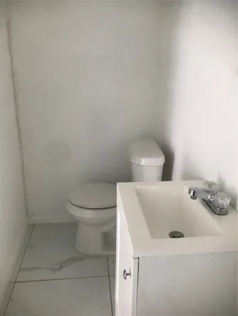 a bathroom with a sink and toilet