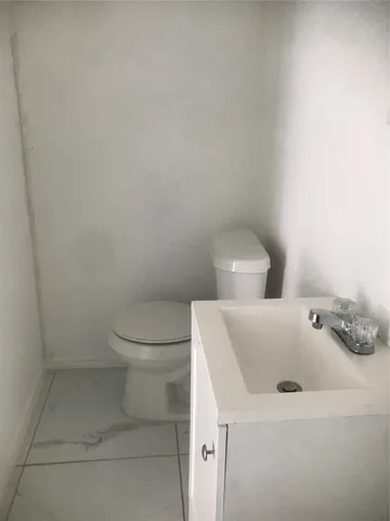 a bathroom with a sink and toilet