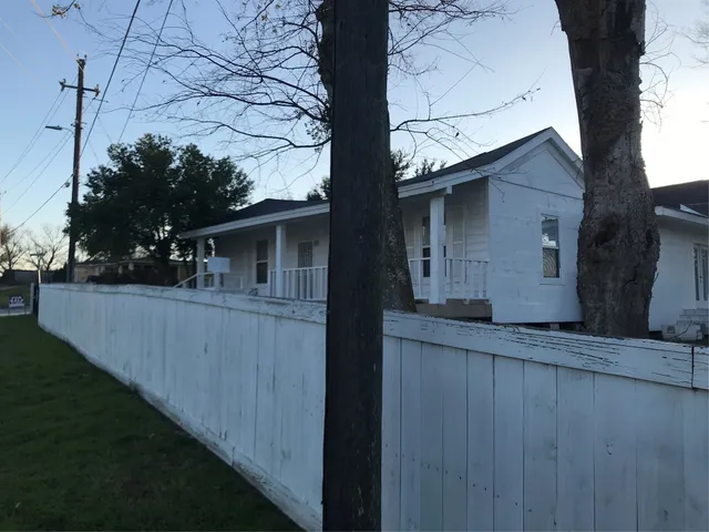 a view of house with backyard