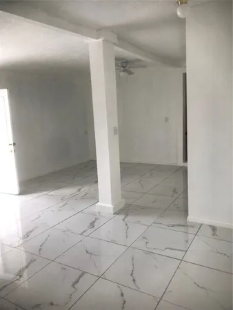 an empty room with white door