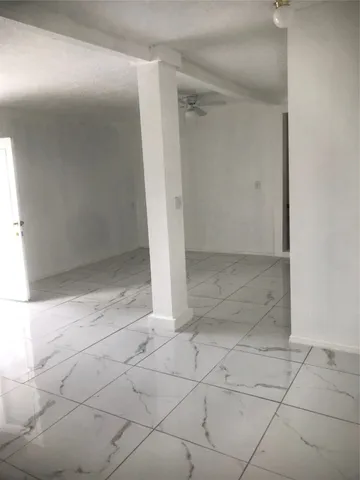 an empty room with white door