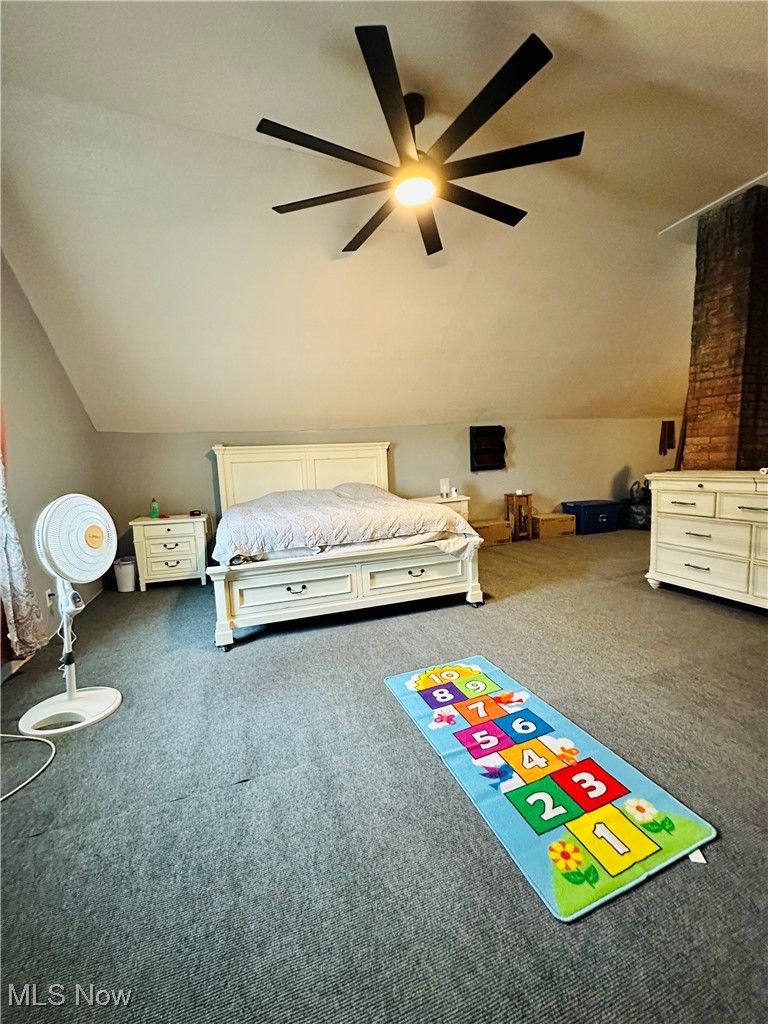 418 Main Street Philo, OH 43771 - Photo 8 of 37 Bedroom with carpet floors, vaulted ceiling, and a ceiling fan