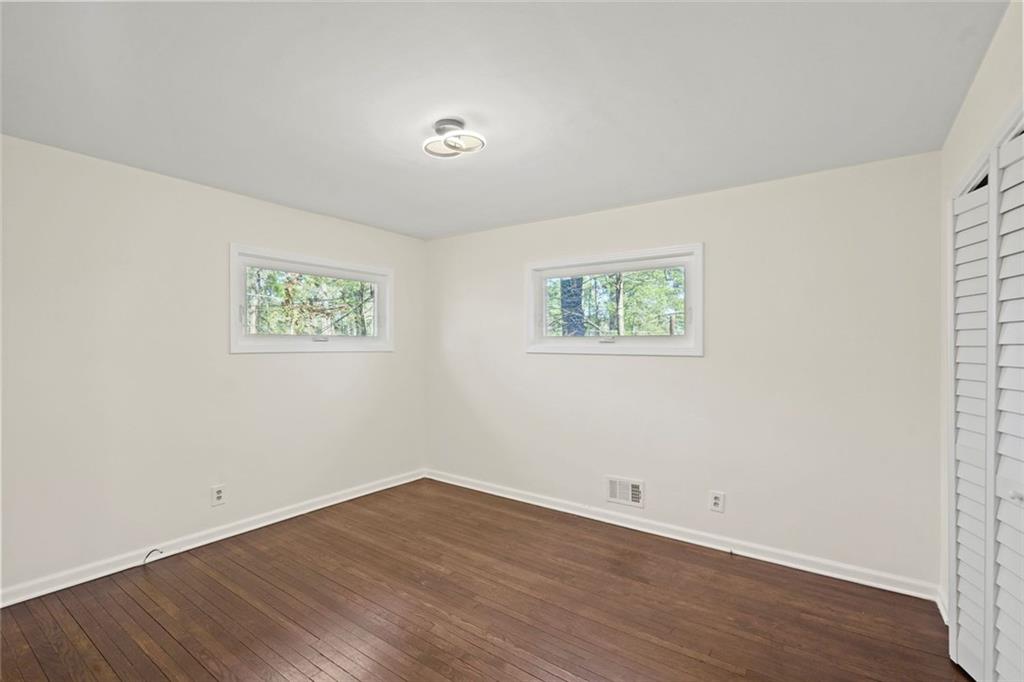 1321 Snapfinger Road Decatur, GA 30032 - Photo 12 of 22 a view of a room with wooden floor and window