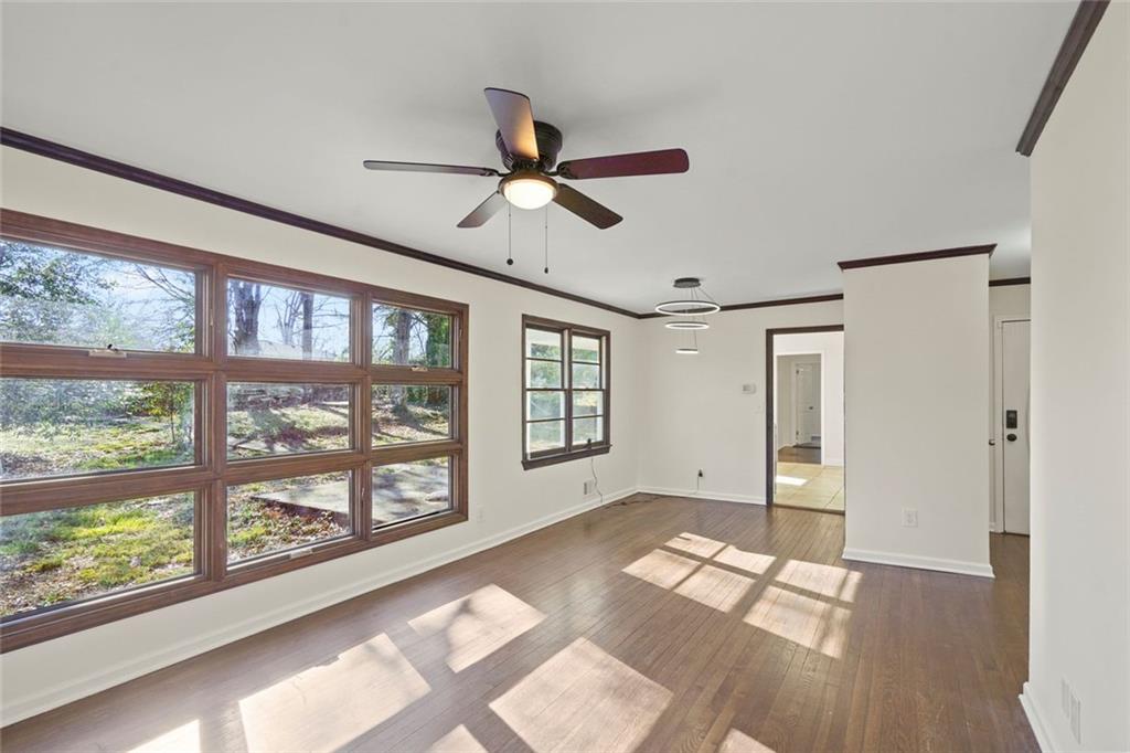 1321 Snapfinger Road Decatur, GA 30032 - Photo 5 of 22 a view of empty room with wooden floor and fan