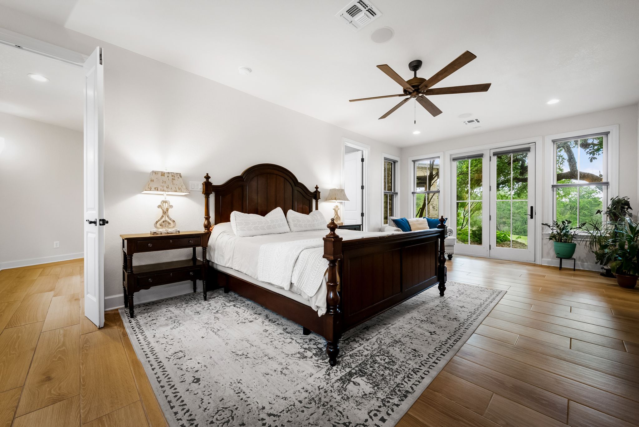 195 Desert Flower Spring Branch, TX 78070 - Photo 14 of 40 Bright room featuring wood-finish flooring, a ceiling fan, and white walls