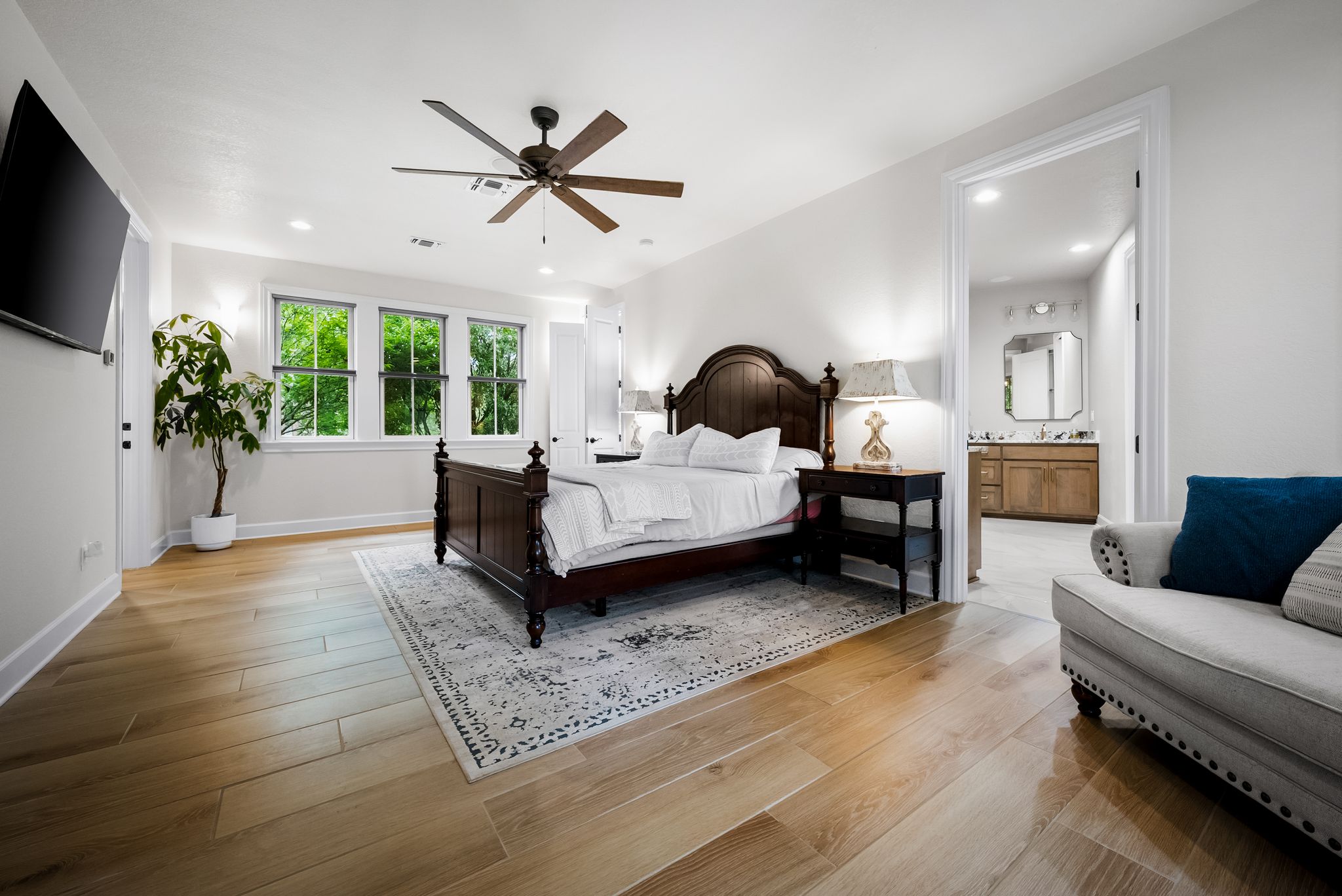 195 Desert Flower Spring Branch, TX 78070 - Photo 15 of 40 Expansive bedroom featuring light wood-finish flooring, recessed lighting, and a dark wood ceiling fan