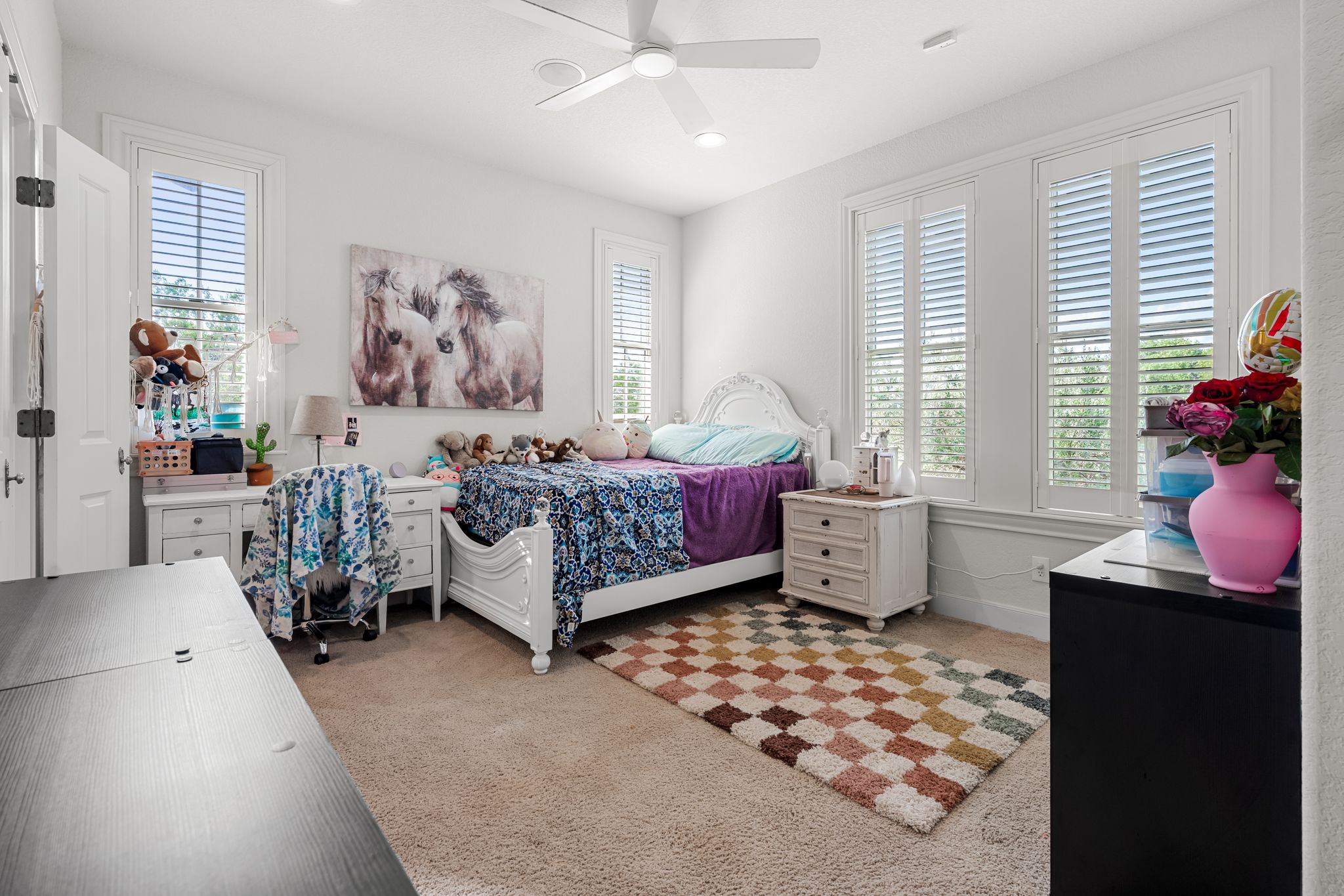195 Desert Flower Spring Branch, TX 78070 - Photo 27 of 40 Light-filled room featuring carpet flooring, crisp white walls, and a ceiling fan with integrated lighting