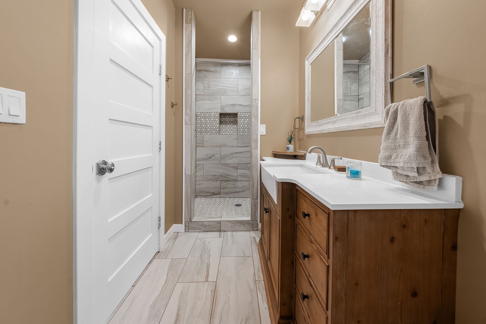 195 Desert Flower Spring Branch, TX 78070 - Photo 34 of 40 Bathroom featuring a farmhouse-style vanity with double sinks, white countertop, and wood-finish cabinetry
