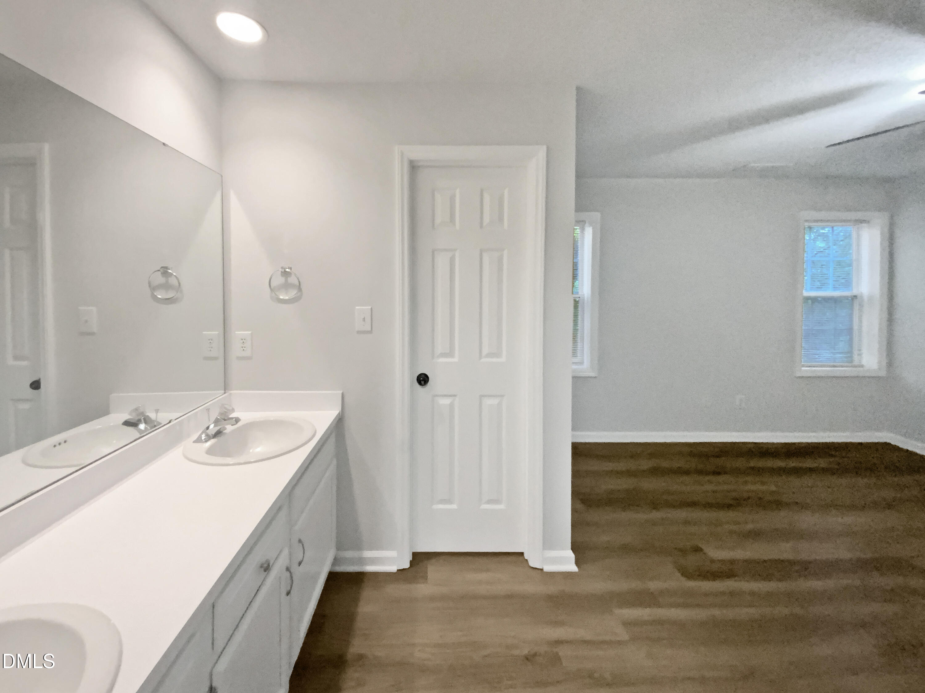 2201 Mountain Mist Court, Unit 103 Raleigh, NC 27603 - Photo 11 of 19 a bathroom with a sink and a mirror