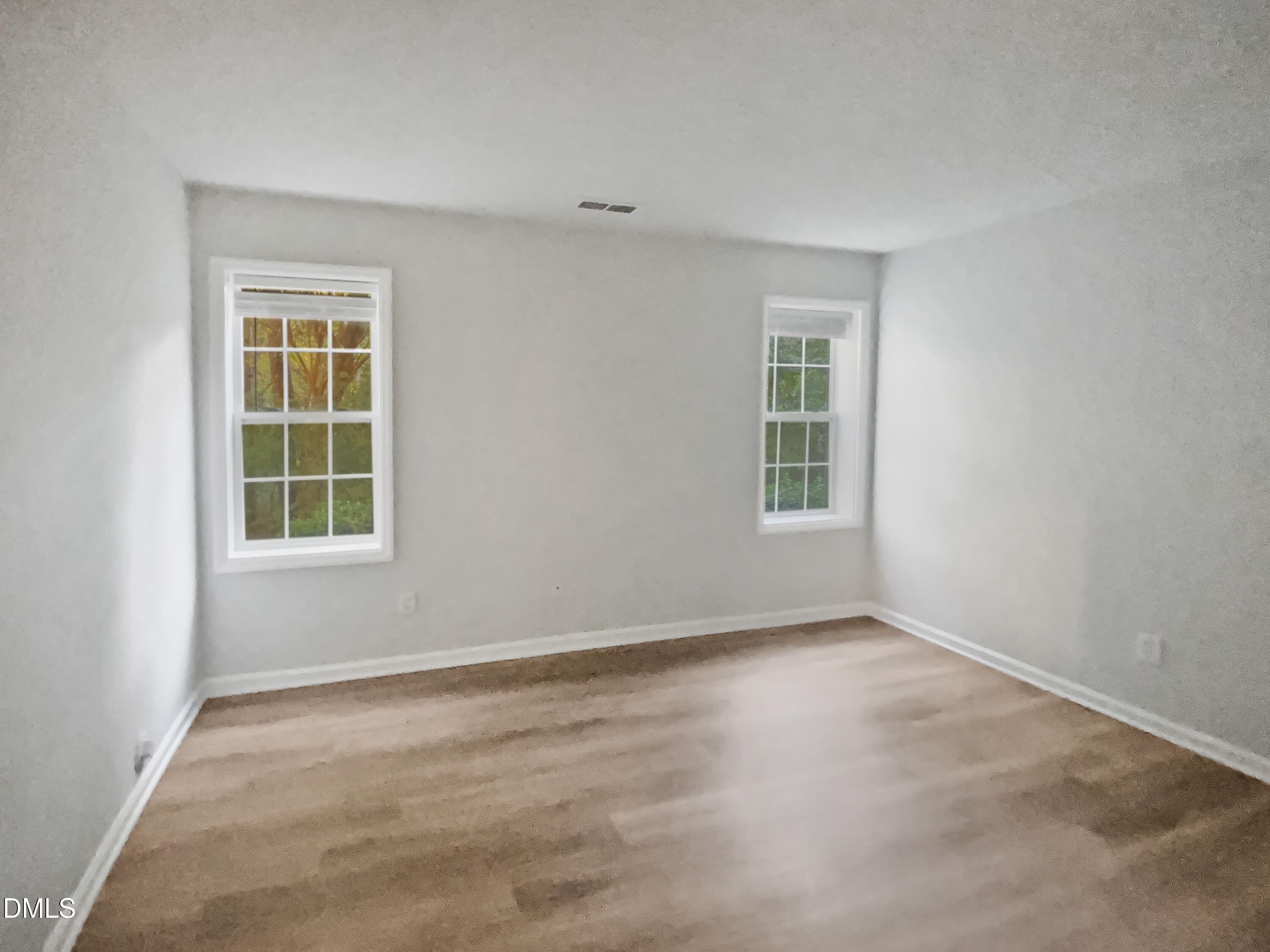 2201 Mountain Mist Court, Unit 103 Raleigh, NC 27603 - Photo 12 of 19 a view of an empty room with a window