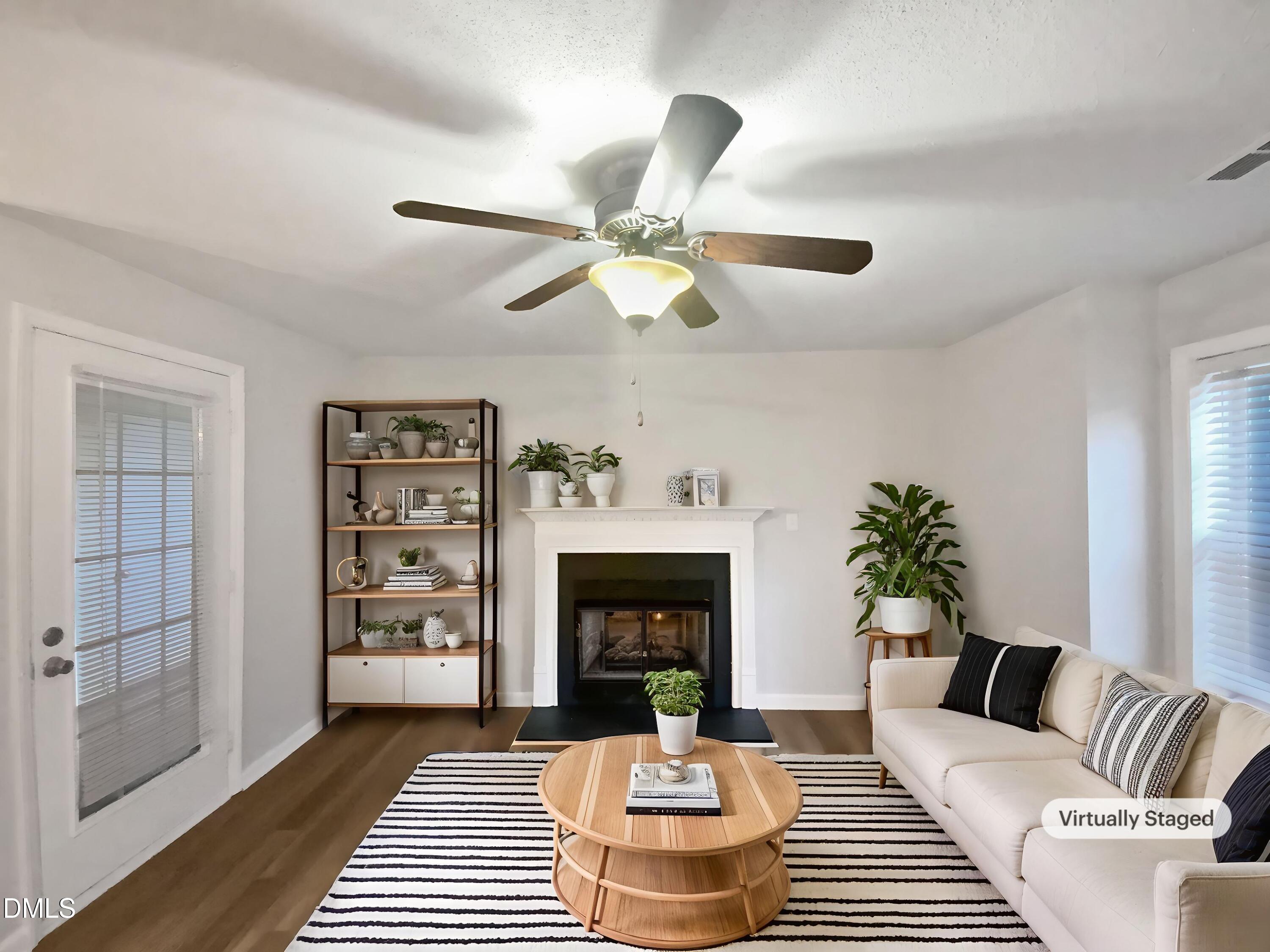 2201 Mountain Mist Court, Unit 103 Raleigh, NC 27603 - Photo 4 of 19 a living room with furniture and a fireplace