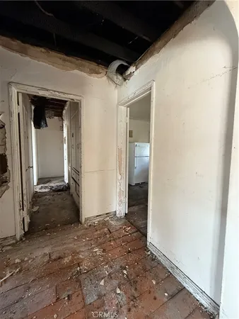 a kitchen with a refrigerator and a stove
