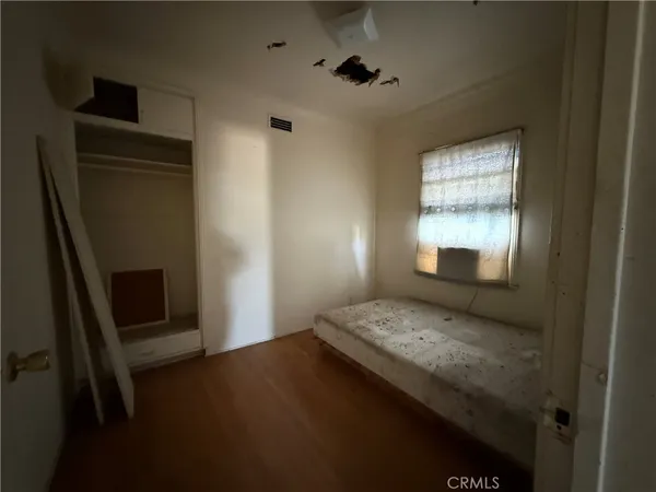 a kitchen with a stove and a white cabinet