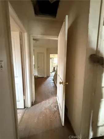 a spacious bedroom with bed and window