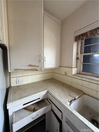 a kitchen with a stove and a sink