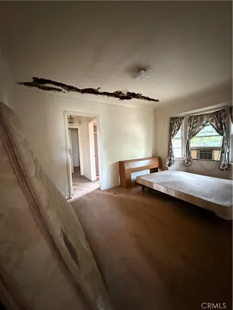 a view of living room with furniture and a fireplace