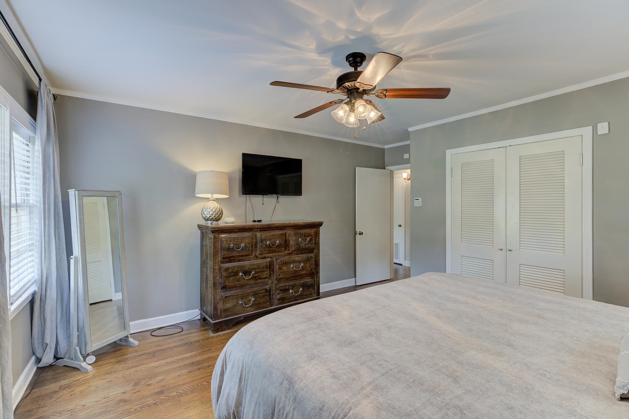 4681 Kaye Road Memphis, TN 38117 - Photo 14 of 25 a bedroom with a bed and a flat tv screen on dresser