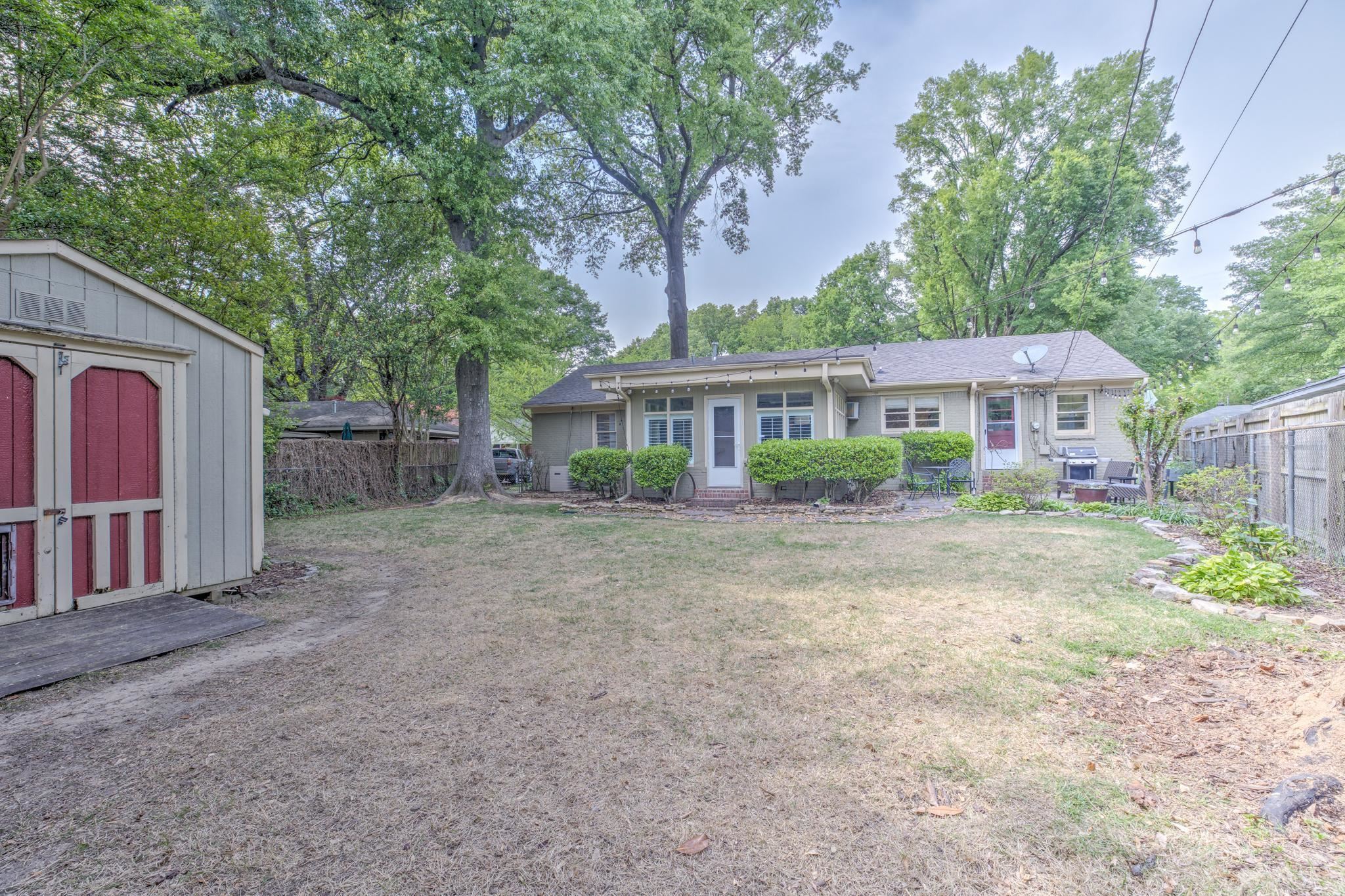 4681 Kaye Road Memphis, TN 38117 - Photo 24 of 25 a front view of a house with a yard and green space