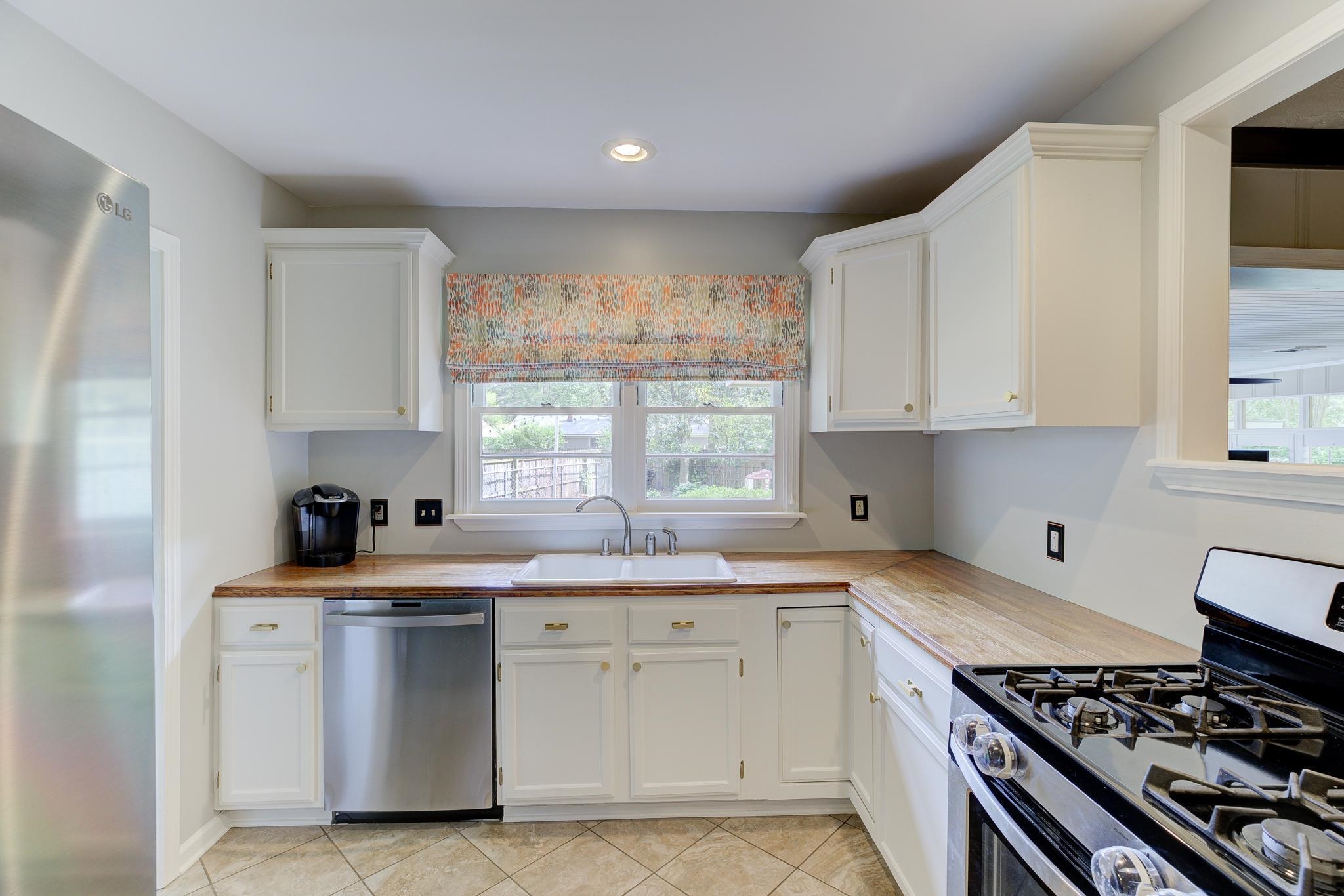 4681 Kaye Road Memphis, TN 38117 - Photo 6 of 25 a kitchen with stainless steel appliances granite countertop a sink stove and cabinets