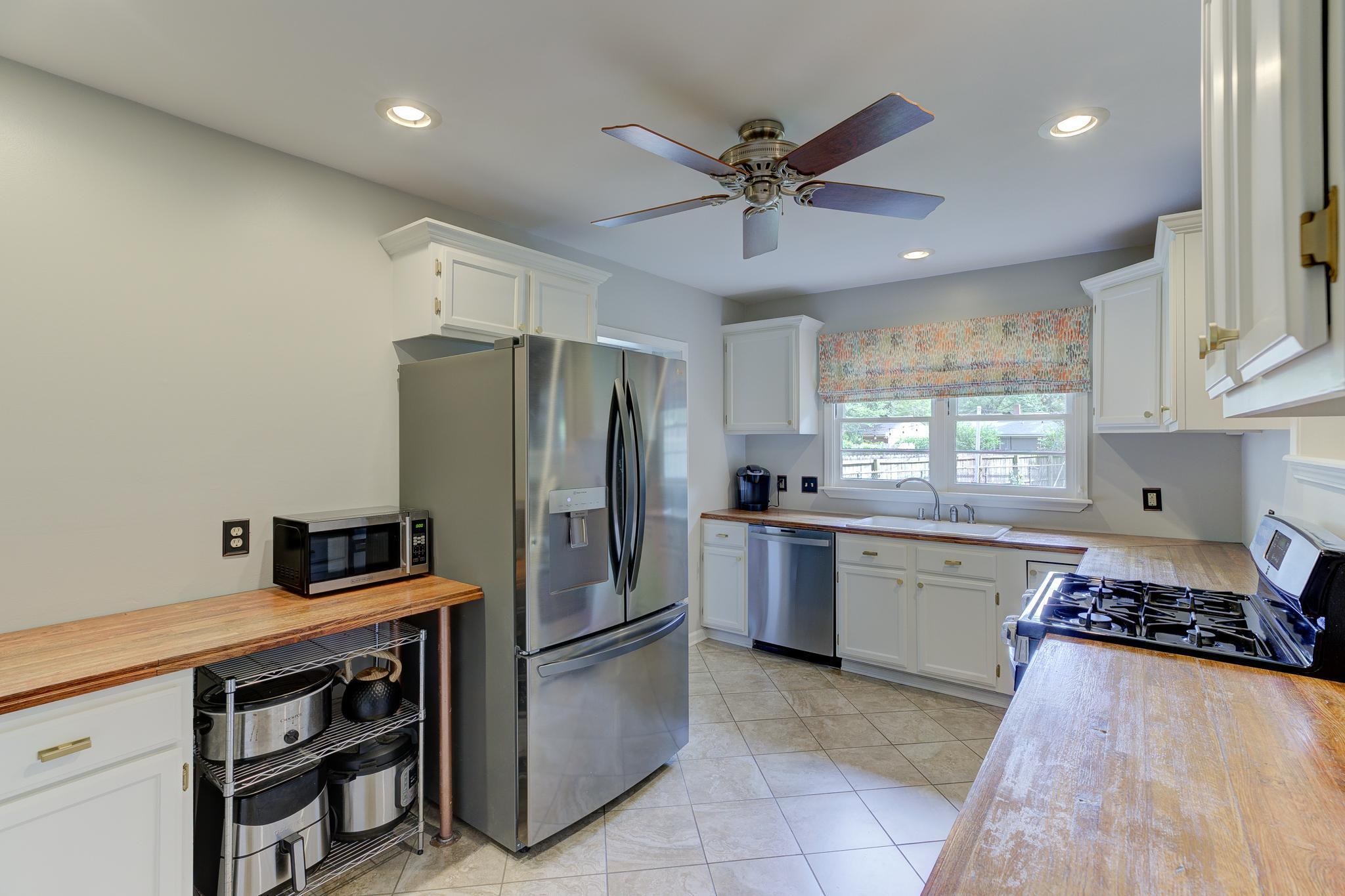 4681 Kaye Road Memphis, TN 38117 - Photo 7 of 25 a kitchen with a sink stainless steel appliances a counter space and cabinets