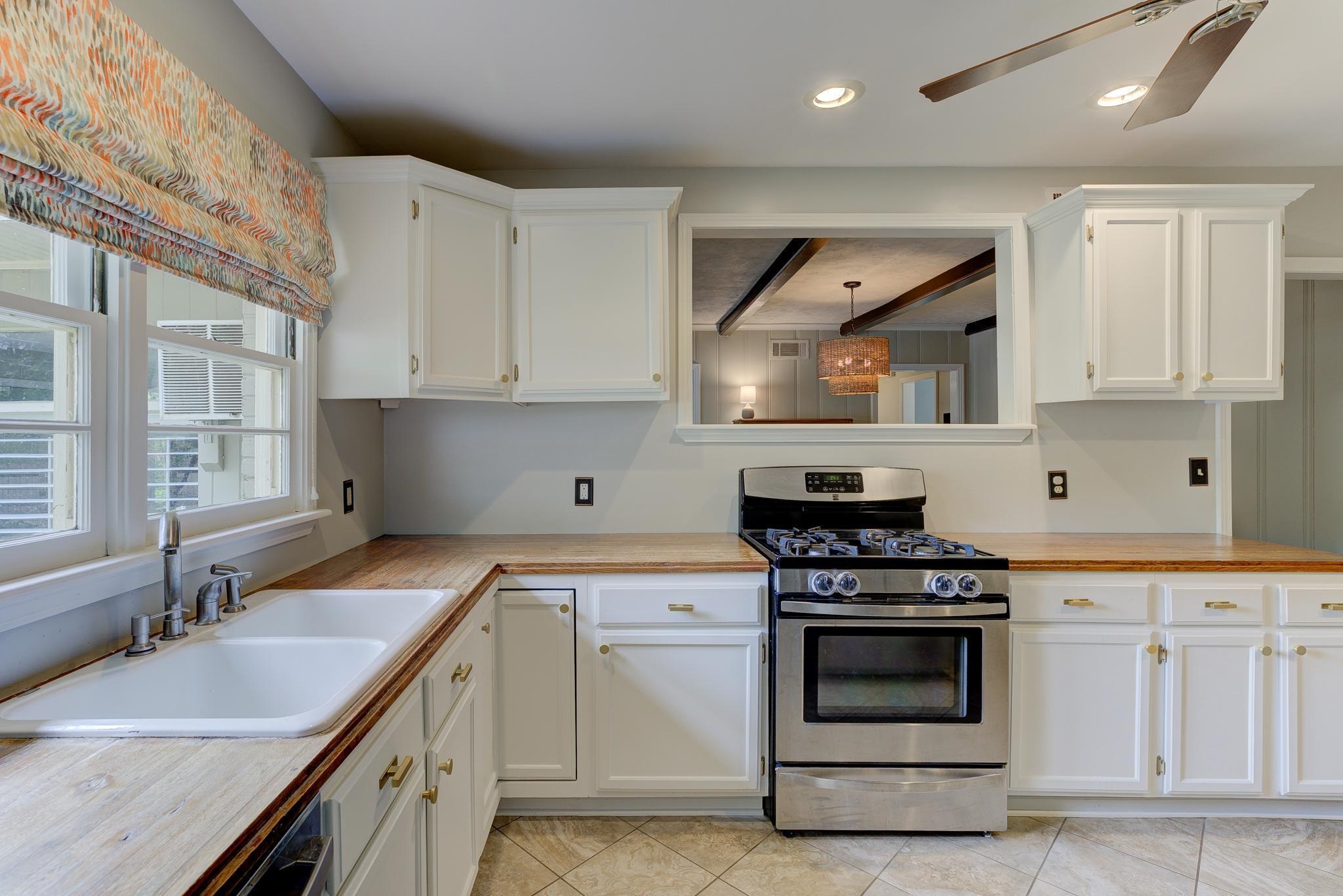 4681 Kaye Road Memphis, TN 38117 - Photo 8 of 25 a kitchen with granite countertop a sink stainless steel appliances and cabinets