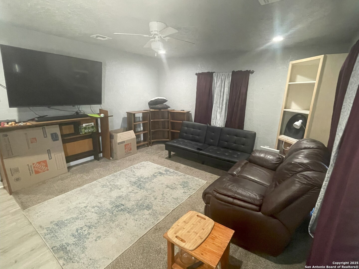 103 South 3rd Street Stockdale, TX 78160 - Photo 18 of 30 a living room with furniture and a flat screen tv