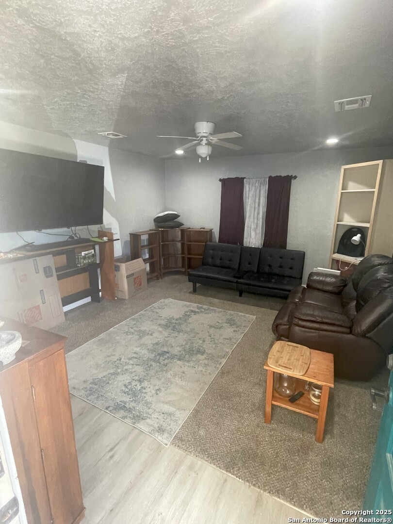 103 South 3rd Street Stockdale, TX 78160 - Photo 19 of 30 a lobby with furniture and a flat screen tv
