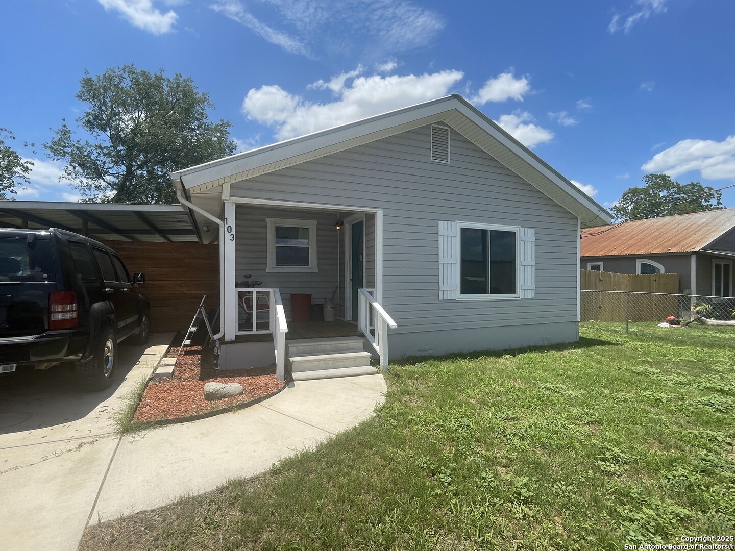 103 South 3rd Street Stockdale, TX 78160 - Photo 20 of 30 a view of a house with backyard and porch