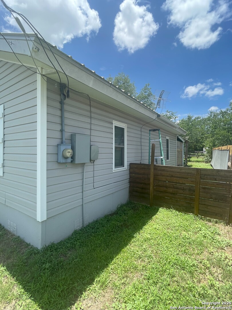 103 South 3rd Street Stockdale, TX 78160 - Photo 21 of 30 a view of a backyard with a large tree