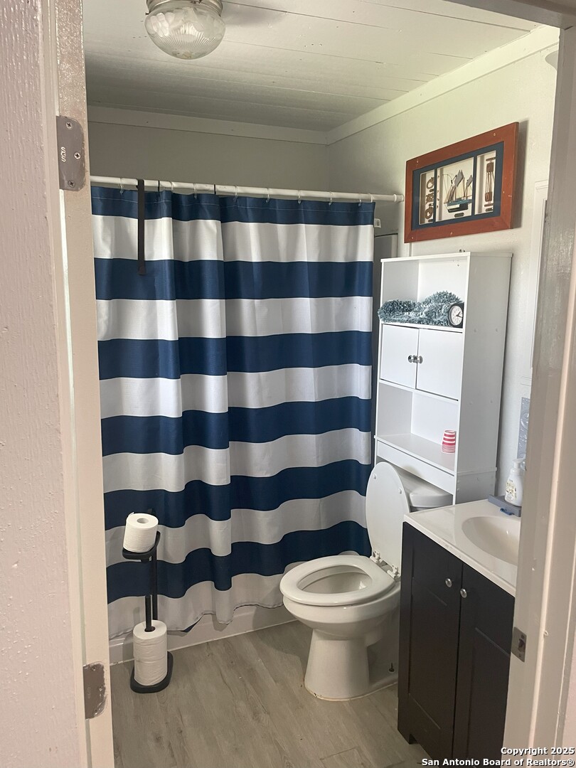 103 South 3rd Street Stockdale, TX 78160 - Photo 25 of 30 a bathroom with a toilet and a shower