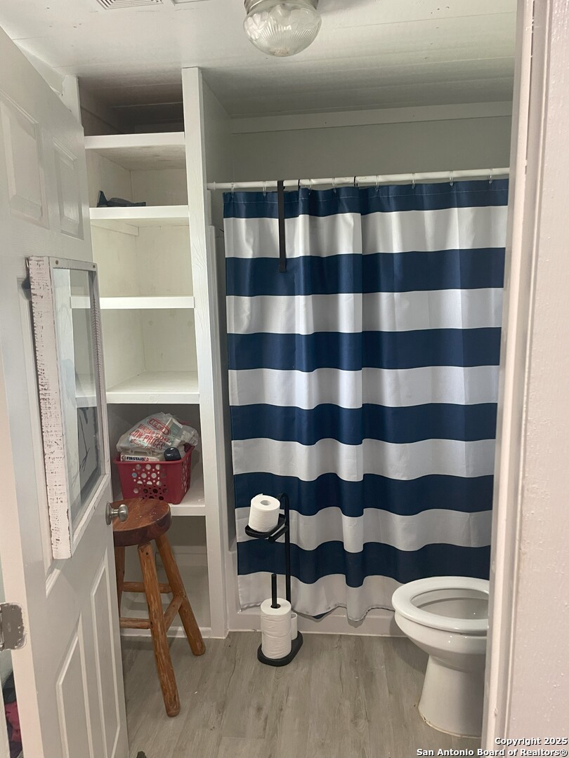 103 South 3rd Street Stockdale, TX 78160 - Photo 26 of 30 a bathroom with a sink toilet and shower