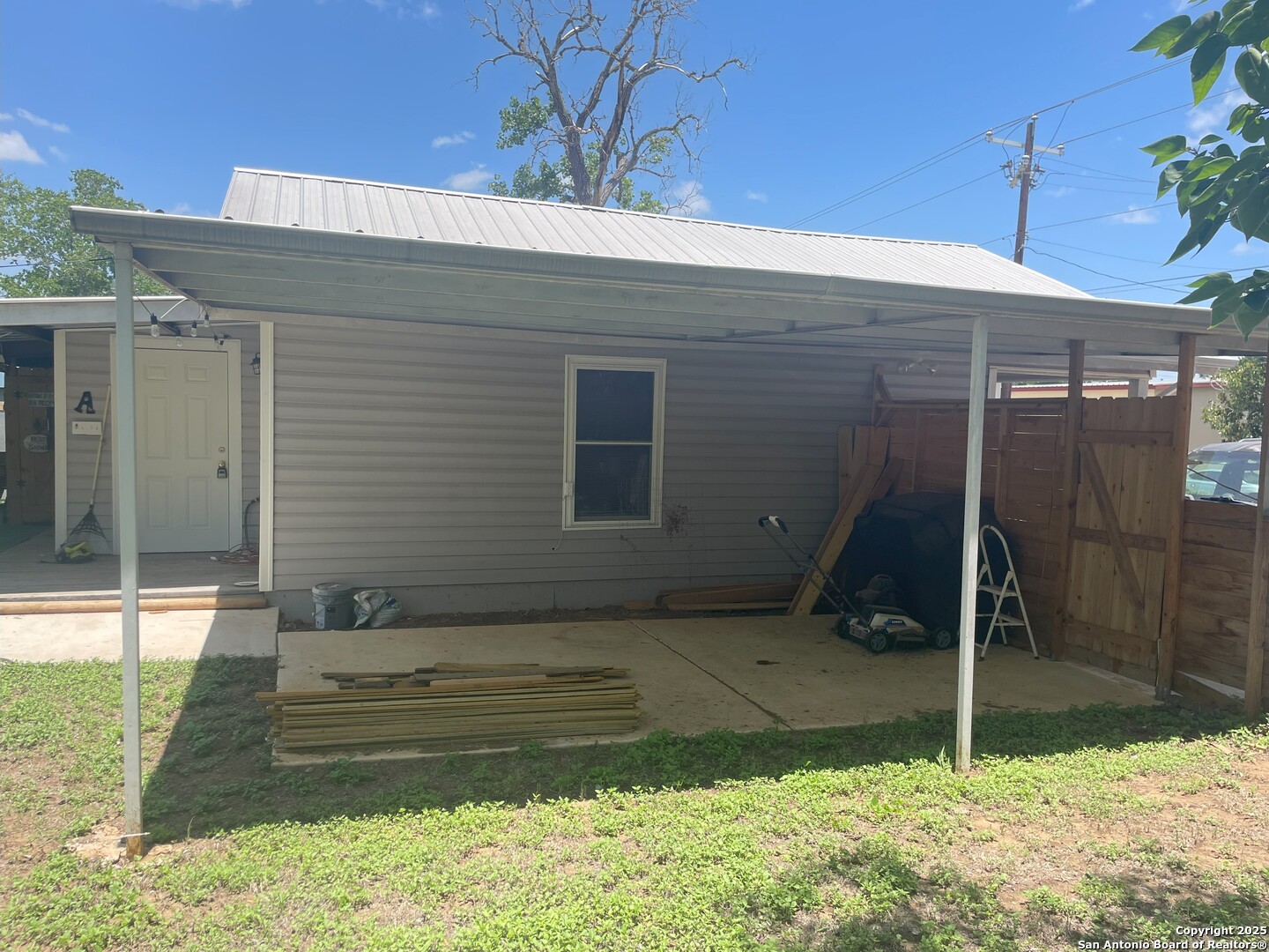 103 South 3rd Street Stockdale, TX 78160 - Photo 28 of 30 a house with a garden