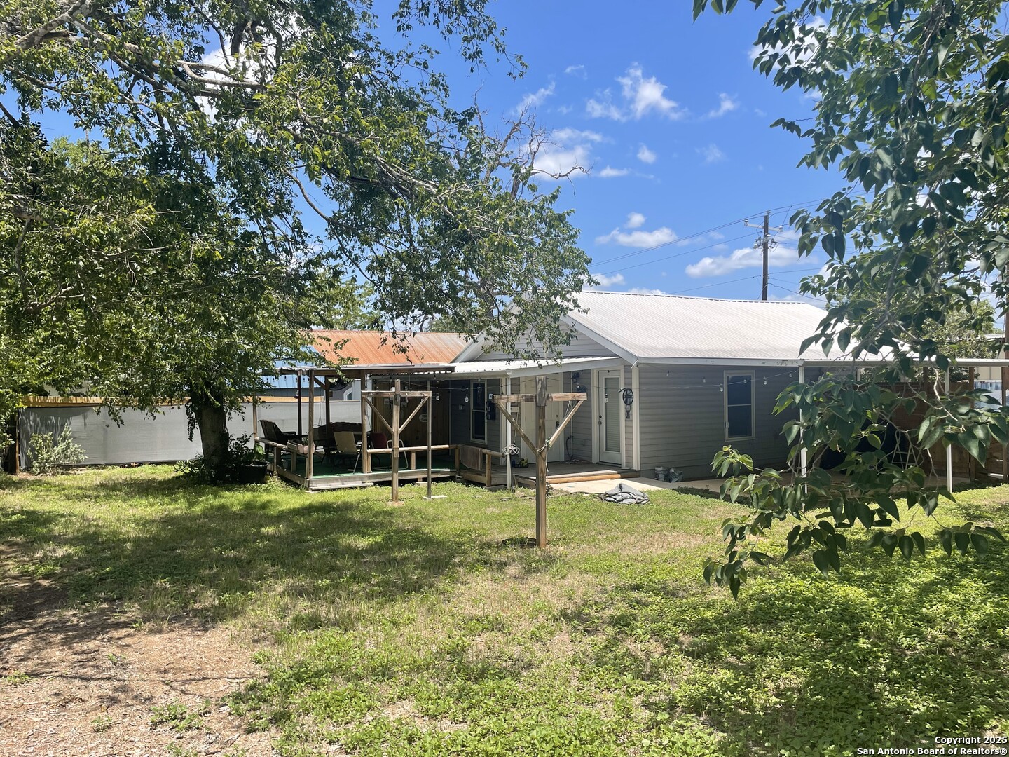 103 South 3rd Street Stockdale, TX 78160 - Photo 7 of 30 a view of a house with backyard and sitting area
