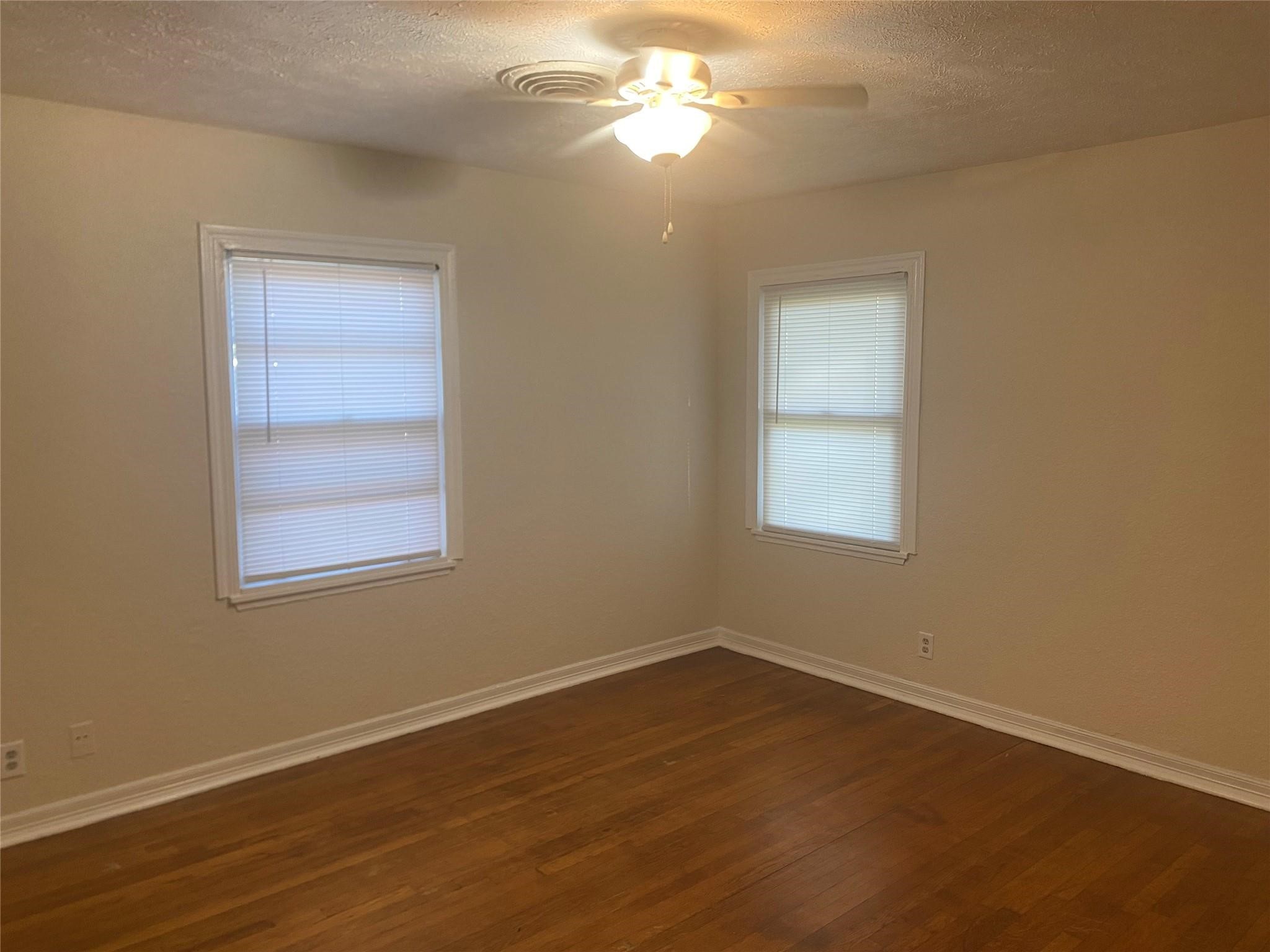 1021 Nottingham Drive Angleton, TX 77515 - Photo 7 of 8 a view of a room that has a window in it