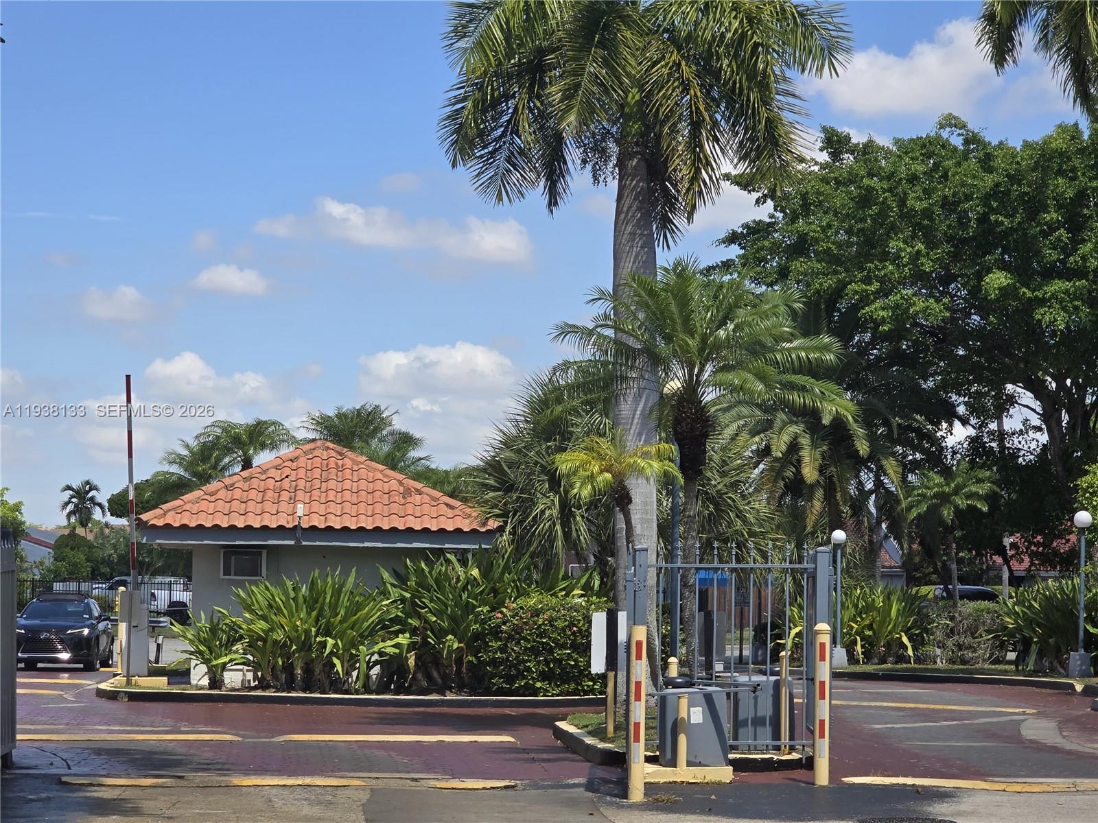 8255 Southwest 152nd Avenue, Unit E207 Miami, FL 33193 - Photo 14 of 14 a view of a park with plants and palm trees