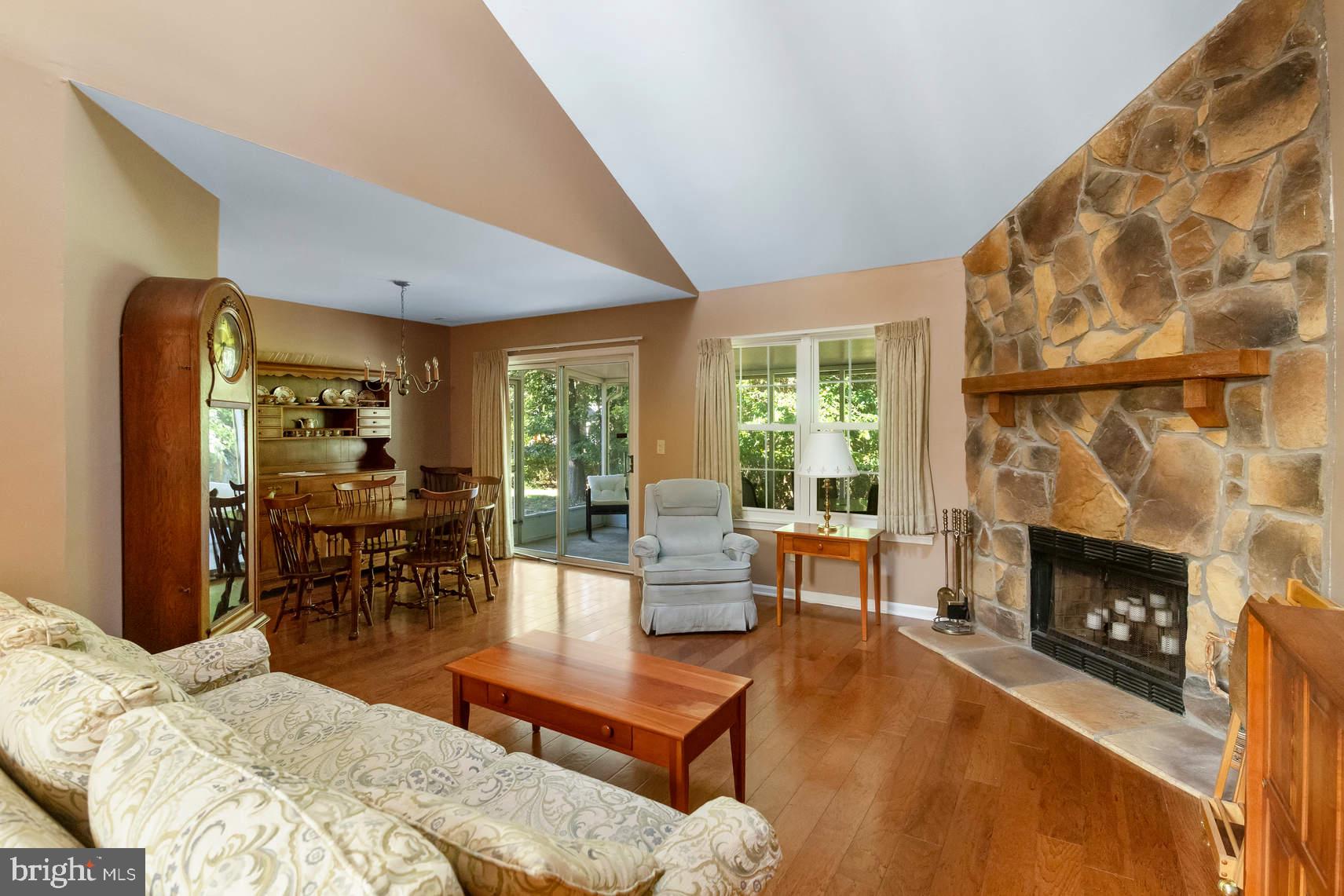 6 Spruce Road Hightstown, NJ 08520 - Photo 2 of 9 a living room with furniture and a fireplace