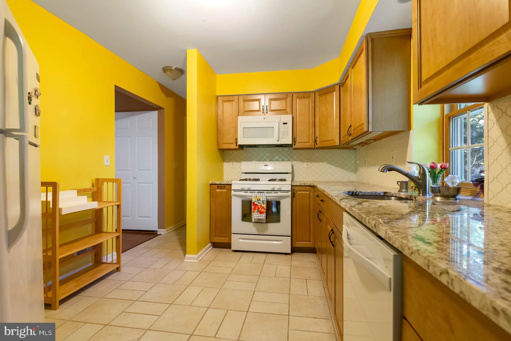 6 Spruce Road Hightstown, NJ 08520 - Photo 3 of 9 a kitchen with stainless steel appliances granite countertop a sink and cabinets