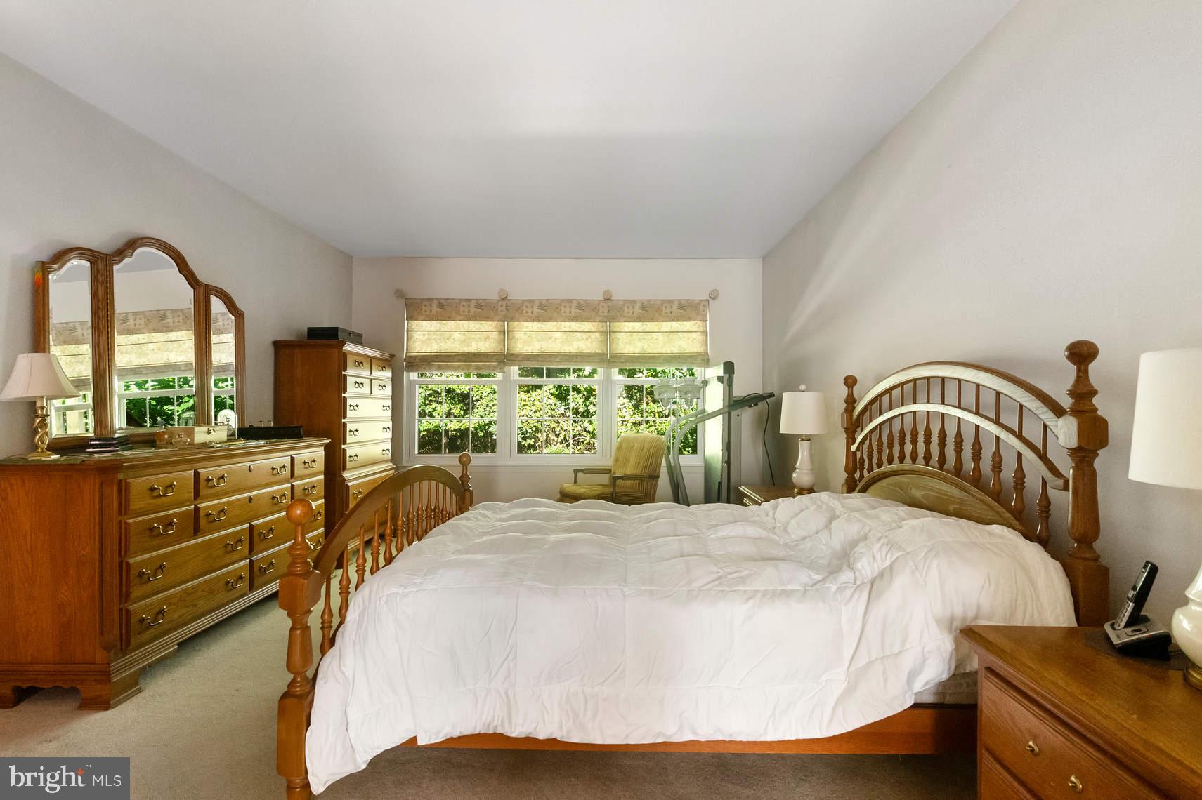 6 Spruce Road Hightstown, NJ 08520 - Photo 5 of 9 a bedroom with a bed and a large window