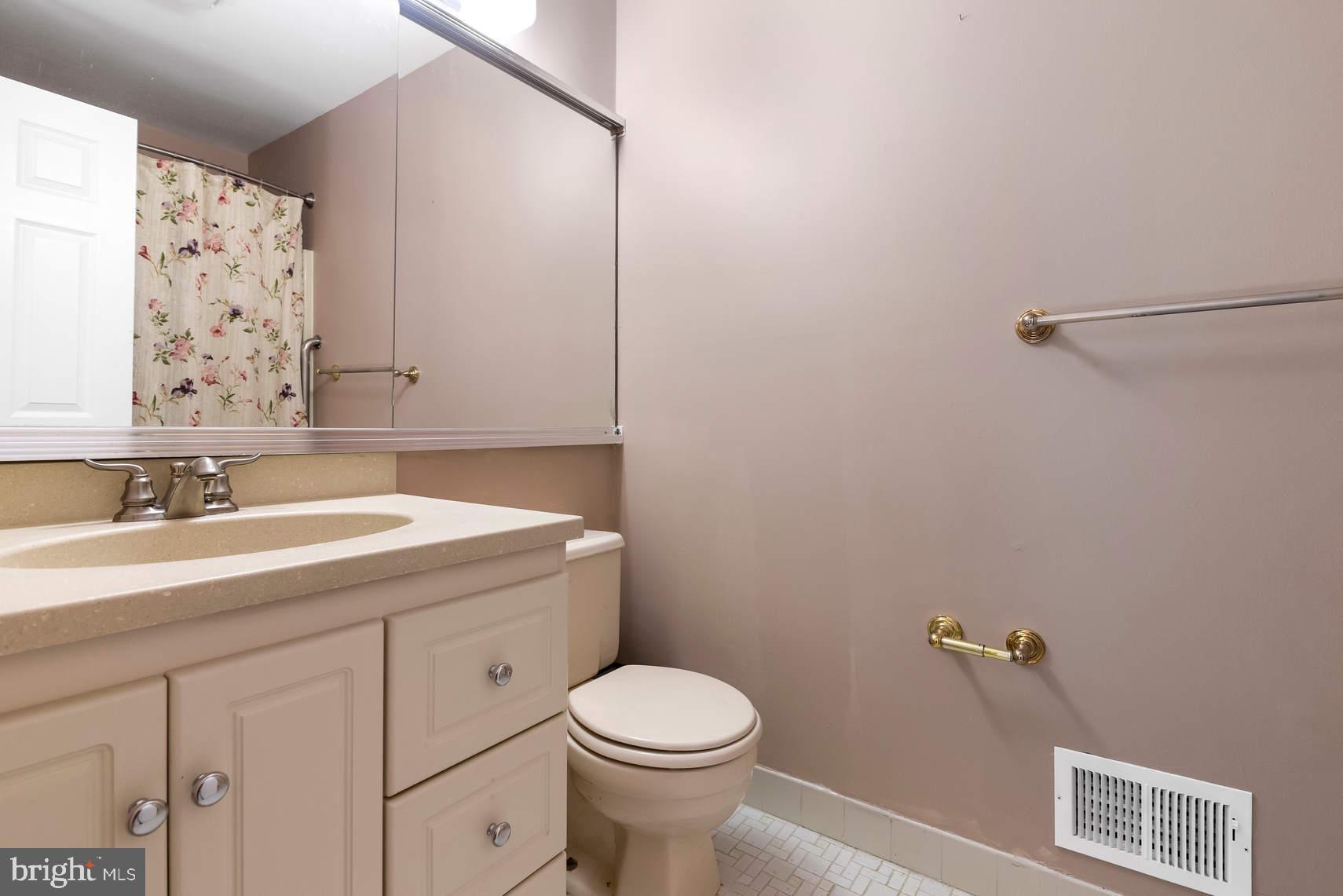 6 Spruce Road Hightstown, NJ 08520 - Photo 7 of 9 a bathroom with a sink toilet and a mirror