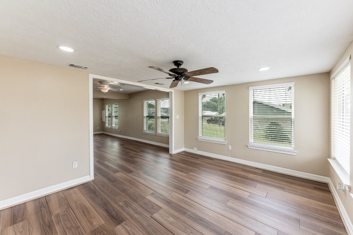280 Crestmont Point Blank, TX 77364 - Photo 11 of 25 a view of an empty room with a window and wooden floor