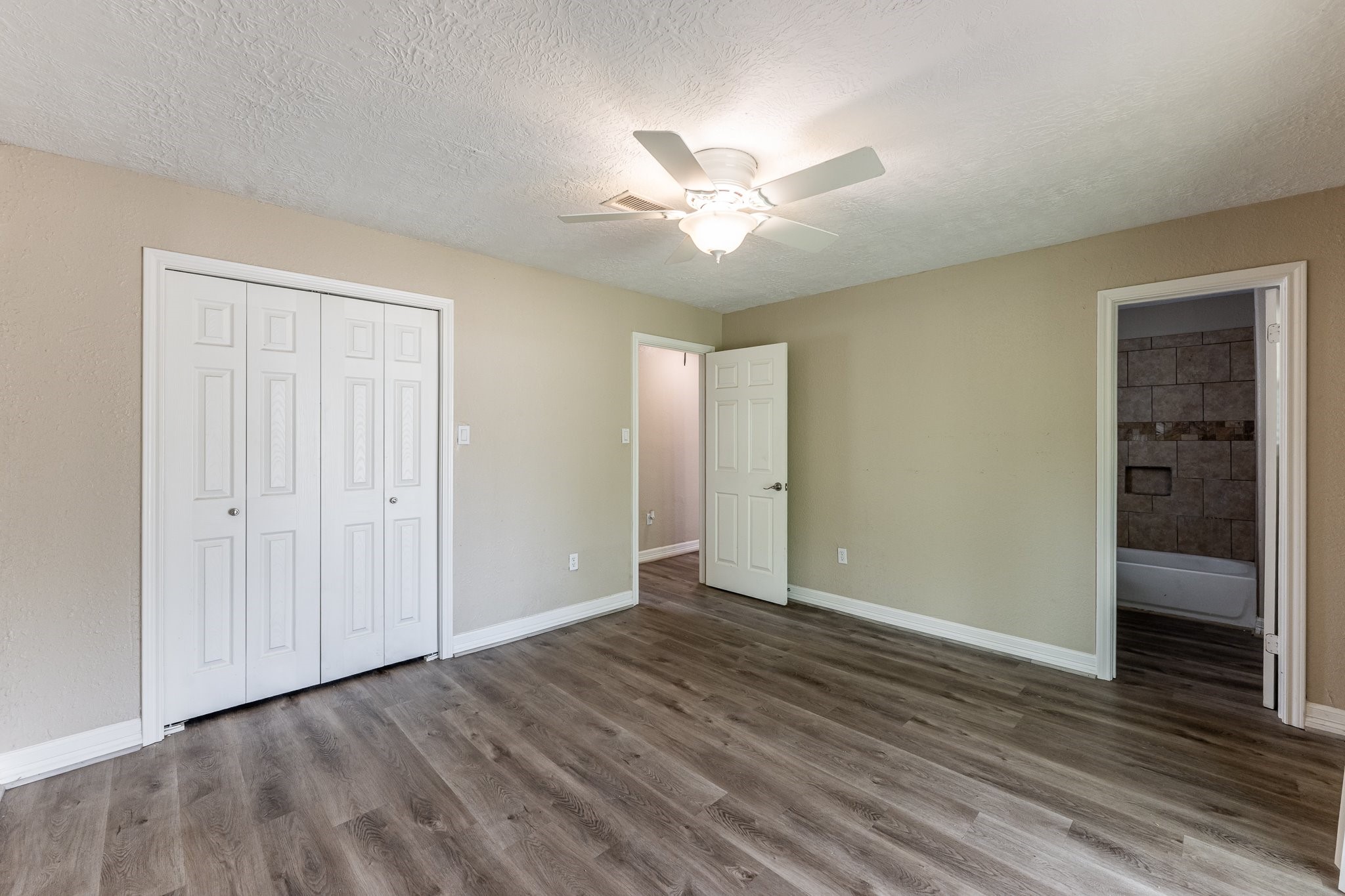 280 Crestmont Point Blank, TX 77364 - Photo 13 of 25 a view of an empty room with wooden floor