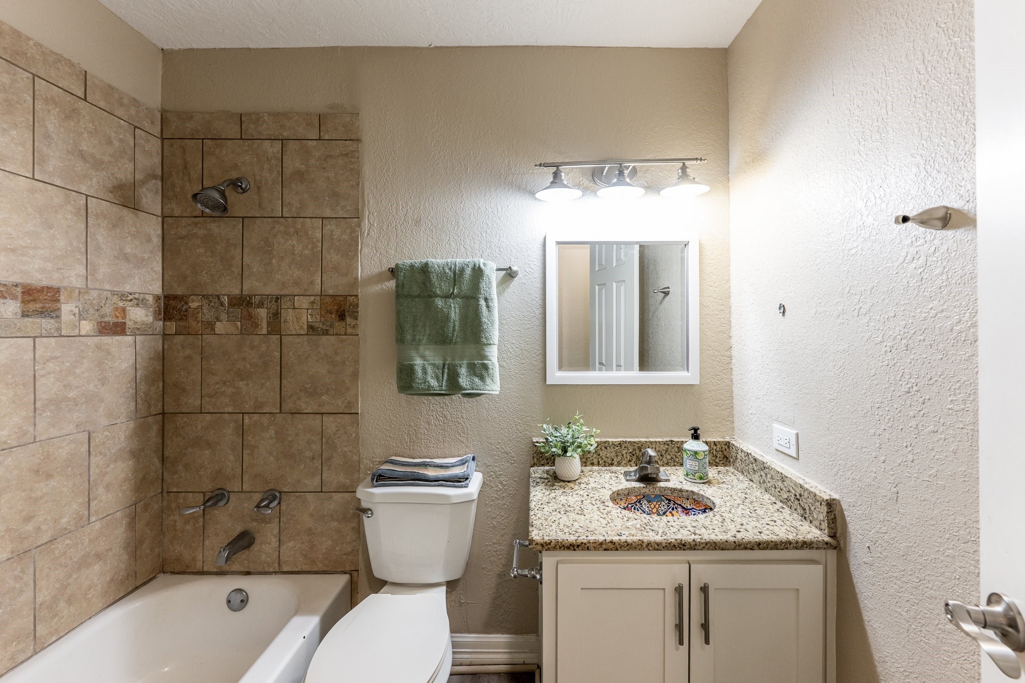 280 Crestmont Point Blank, TX 77364 - Photo 17 of 25 a bathroom with a granite countertop sink toilet and shower